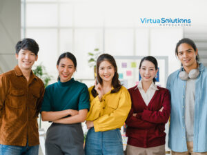 Diverse outsourcing team smiling together