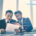 Businessmen reviewing documents together