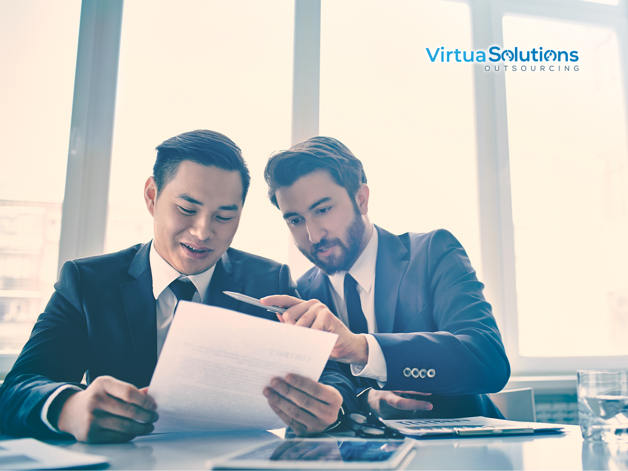 Businessmen reviewing documents together